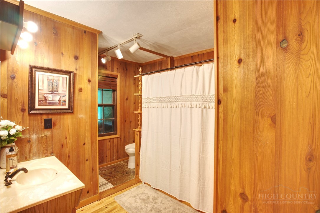 9440 Blackberry Road Lenoir, NC 28645 - Photo 14 of 30 a bathroom with a sink and a mirror