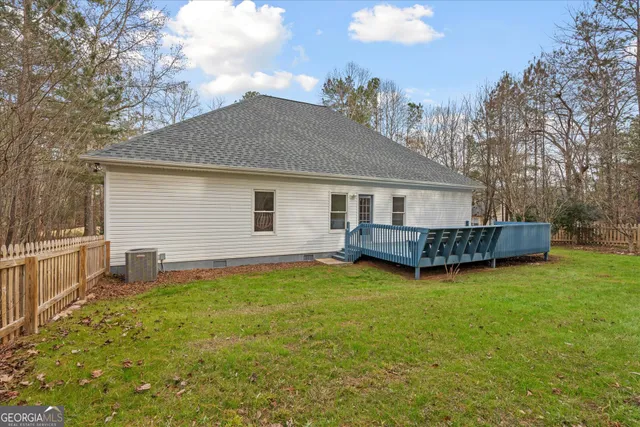 a view of a house with yard and a garden