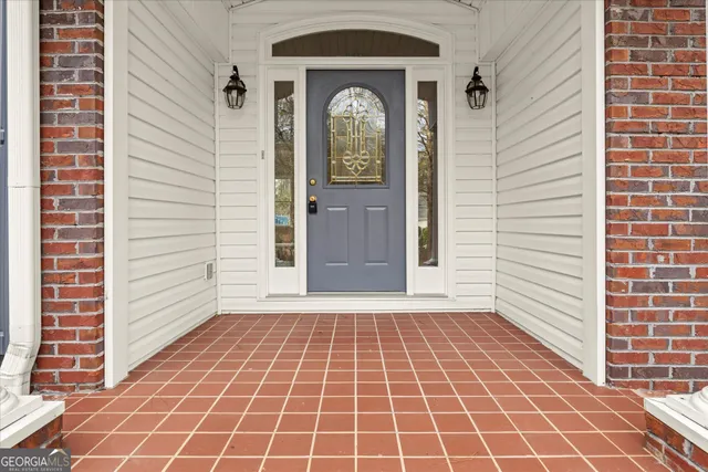 a view of a brick house with a door