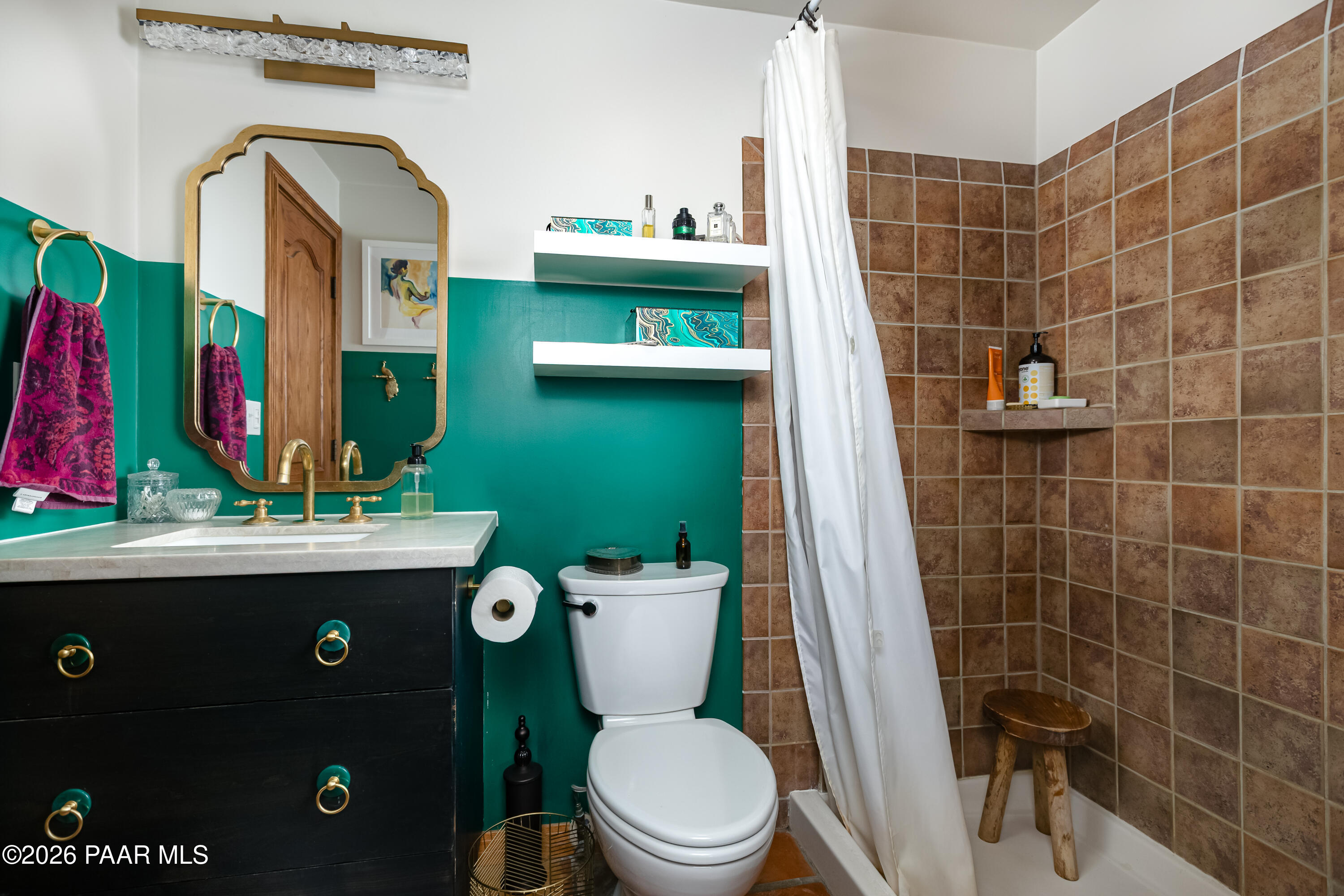 372 Verde Lane Prescott, AZ 86303 - Photo 16 of 23 a bathroom with a toilet sink and mirror