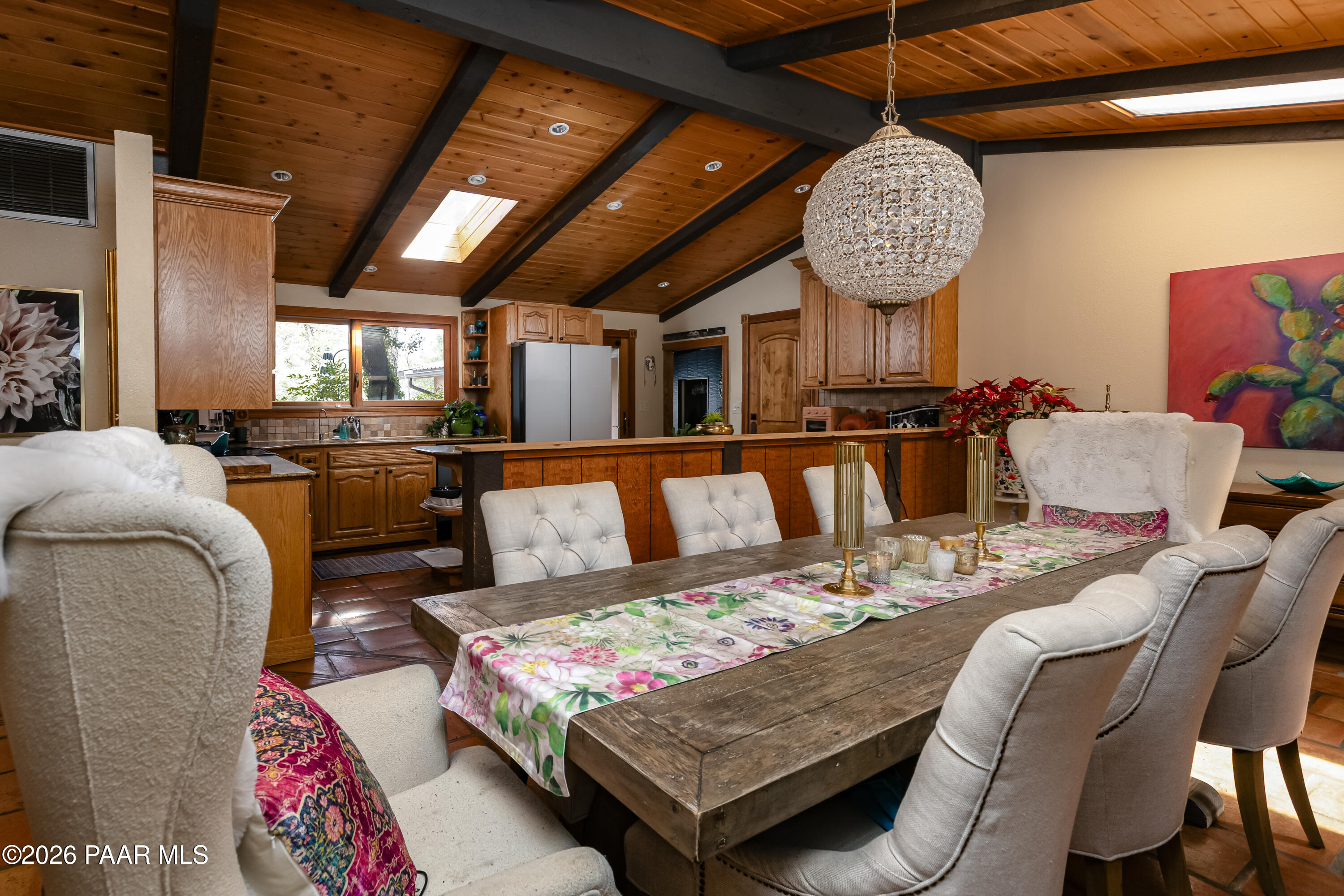 372 Verde Lane Prescott, AZ 86303 - Photo 7 of 23 a living room with furniture a chandelier and a table