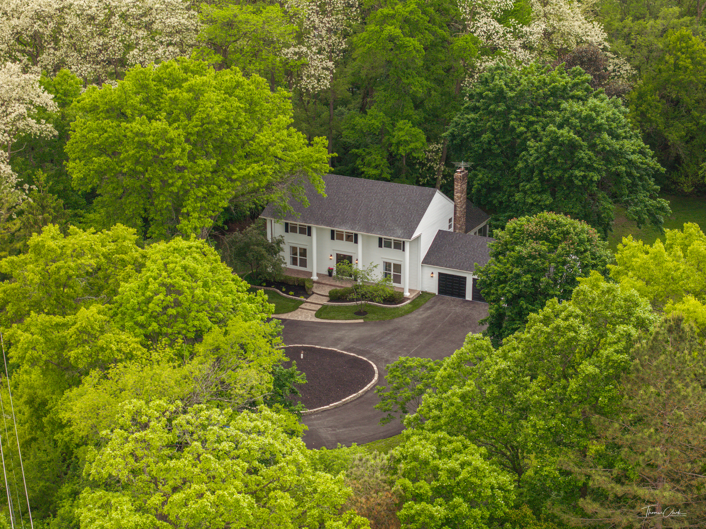 an aerial view of a house with a garden