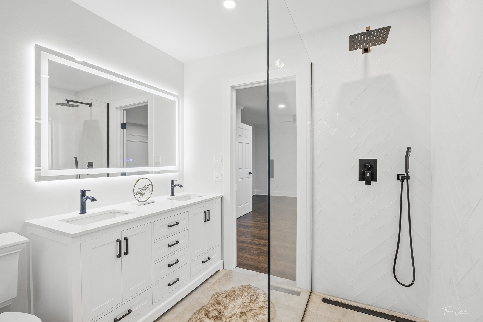 27036 West Miller Road Lake Barrington, IL 60010 - Photo 22 of 52 a bathroom with a double vanity sink a mirror and shower