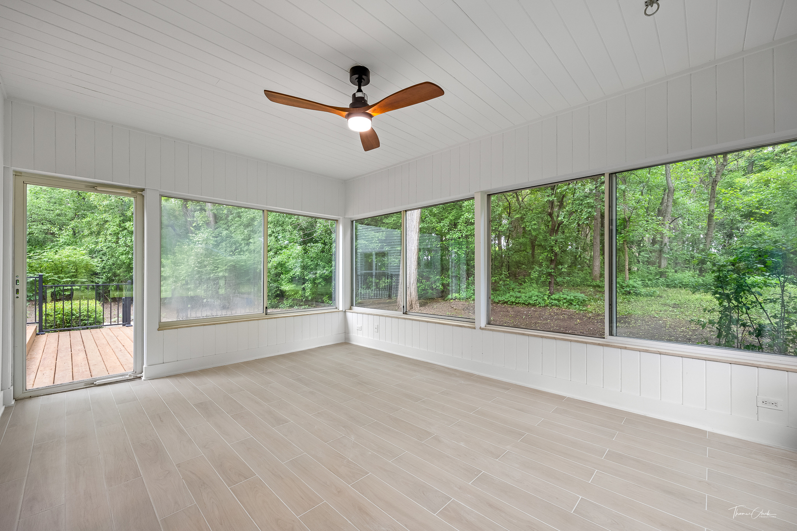 27036 West Miller Road Lake Barrington, IL 60010 - Photo 34 of 52 a view of a livingroom with a ceiling fan and a large window