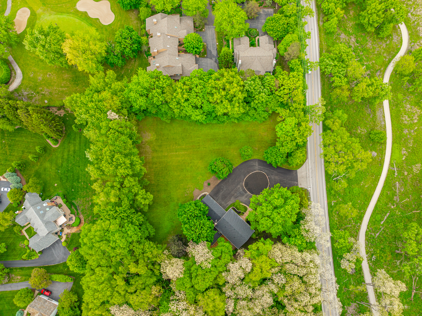 27036 West Miller Road Lake Barrington, IL 60010 - Photo 48 of 52 an aerial view of a house with pool lake outdoor seating and yard