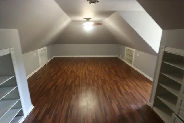 a view of an empty room and wooden floor