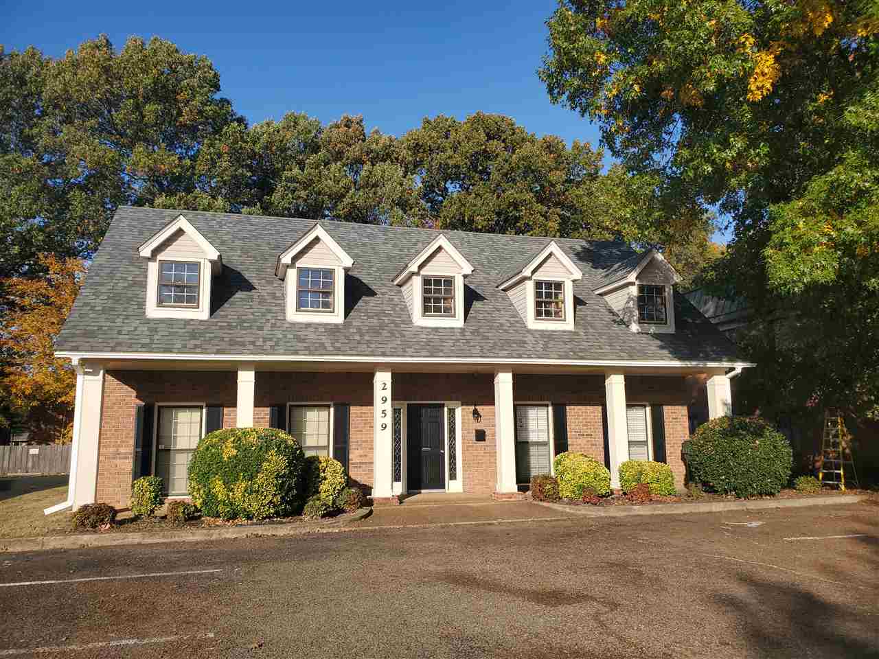2959 Elmore Park Road, Unit 8 Bartlett, TN 38134 - Photo 1 of 4 a front view of a brick house with a yard