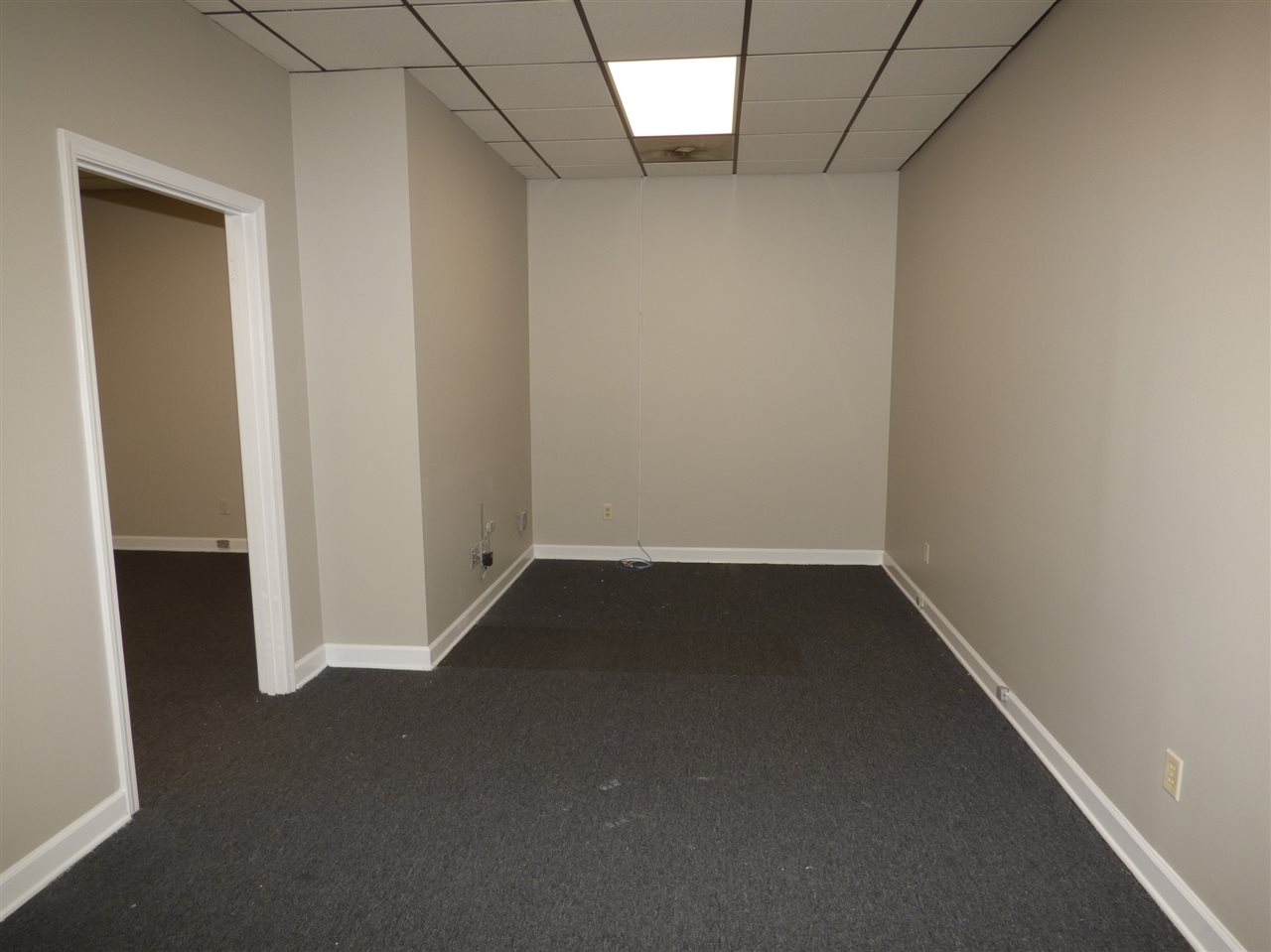 2959 Elmore Park Road, Unit 8 Bartlett, TN 38134 - Photo 3 of 4 an empty room with a door