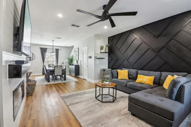 a living room with furniture and a fireplace