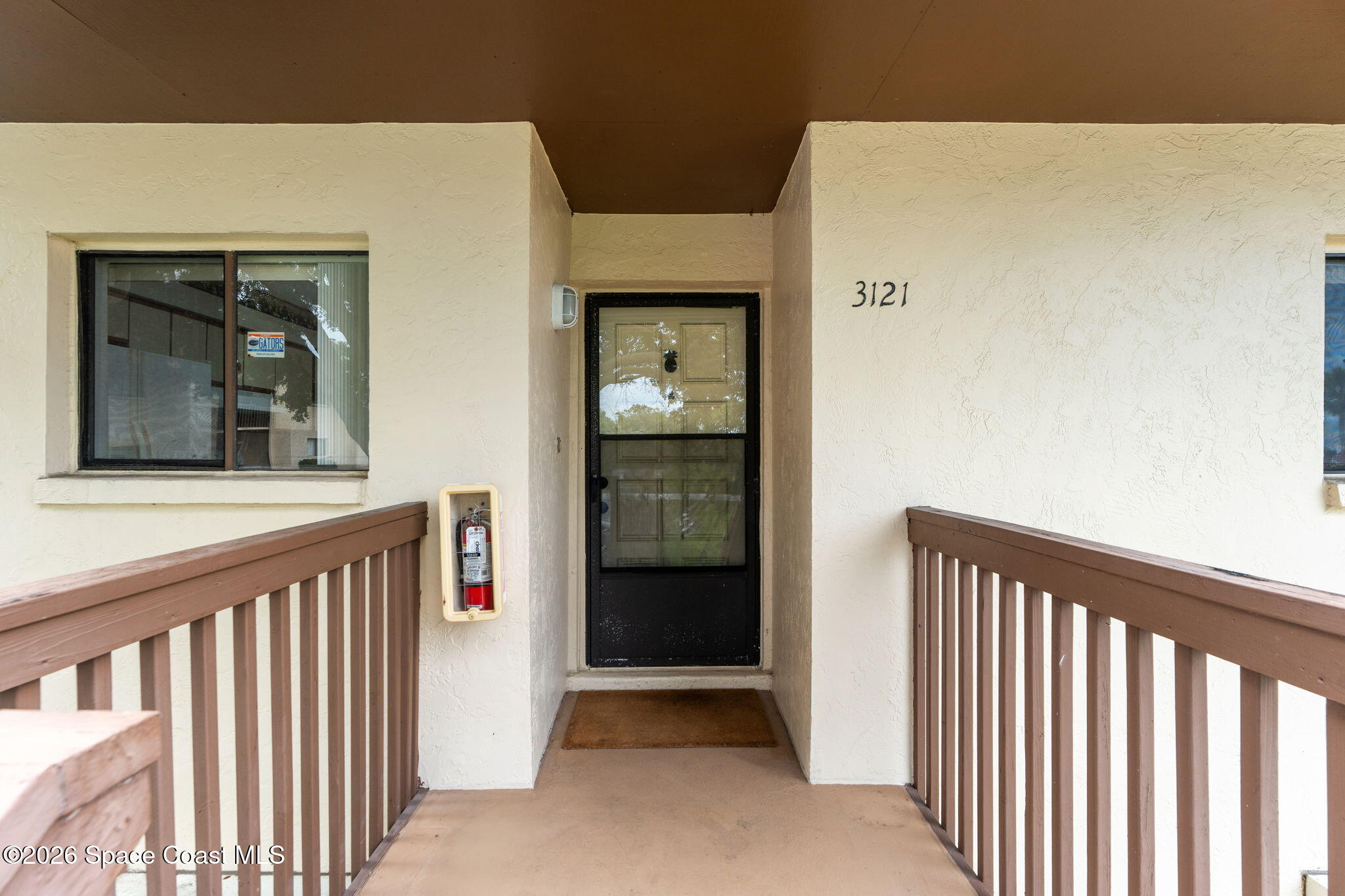 3121 Kirkland Road Northeast Palm Bay, FL 32905 - Photo 5 of 52 a view of a front door