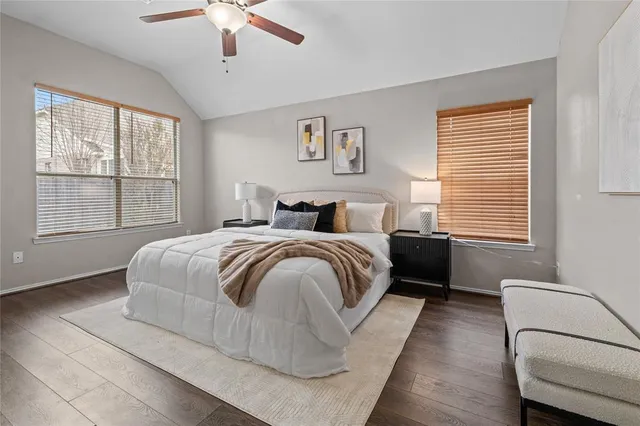 a bedroom with a large bed and a window