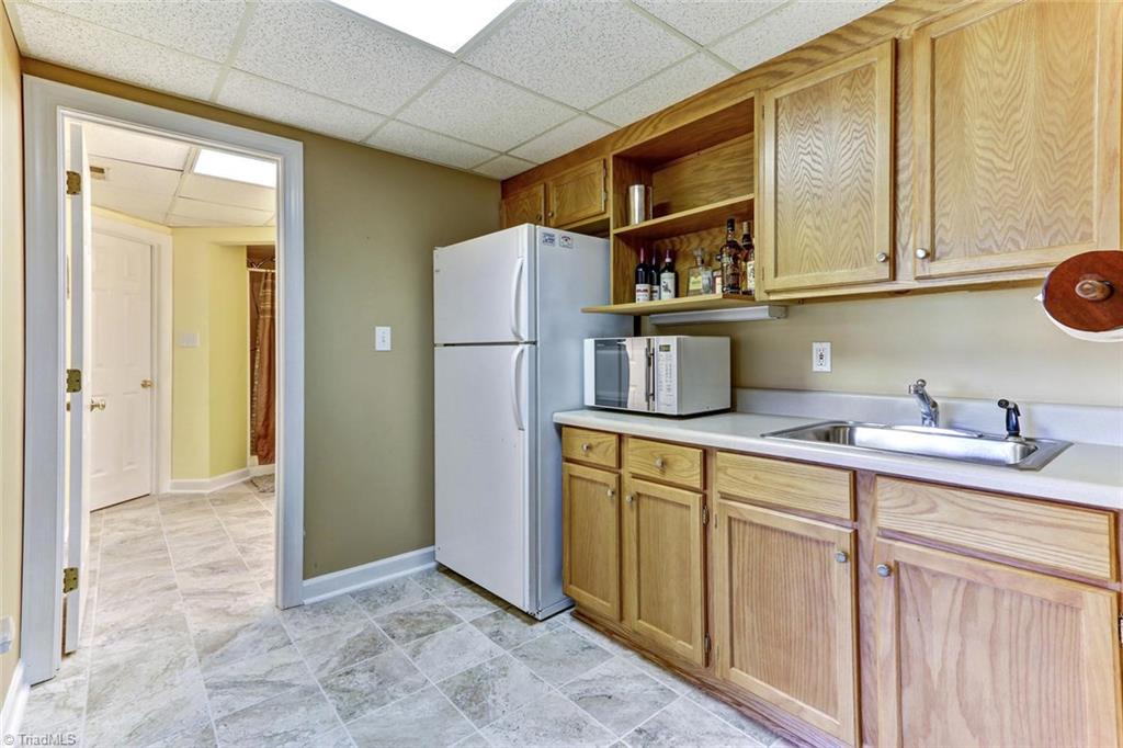 5203 Red Fox Drive Oak Ridge, NC 27310 - Photo 22 of 30 A basement kitchenette....