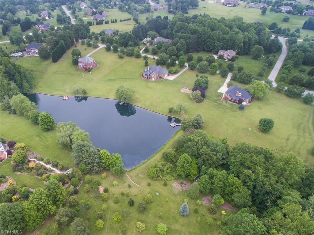 5203 Red Fox Drive Oak Ridge, NC 27310 - Photo 30 of 30 Notice from this aerial shot how the home is privately secluded from the surrounding homes. Make this paradise yours by calling for an appointment today.