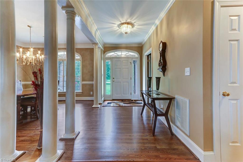 5203 Red Fox Drive Oak Ridge, NC 27310 - Photo 4 of 30 From the moment that you enter, you know that this home was built with quality craftsmanship. Note that the hardwood floors have just been refinished.