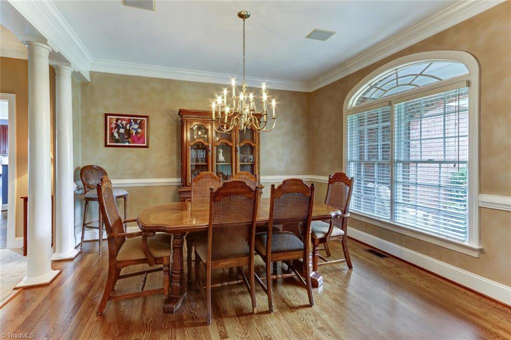 5203 Red Fox Drive Oak Ridge, NC 27310 - Photo 5 of 30 To the right as you enter is the formal dining room which is basked in light by the huge transomed window.