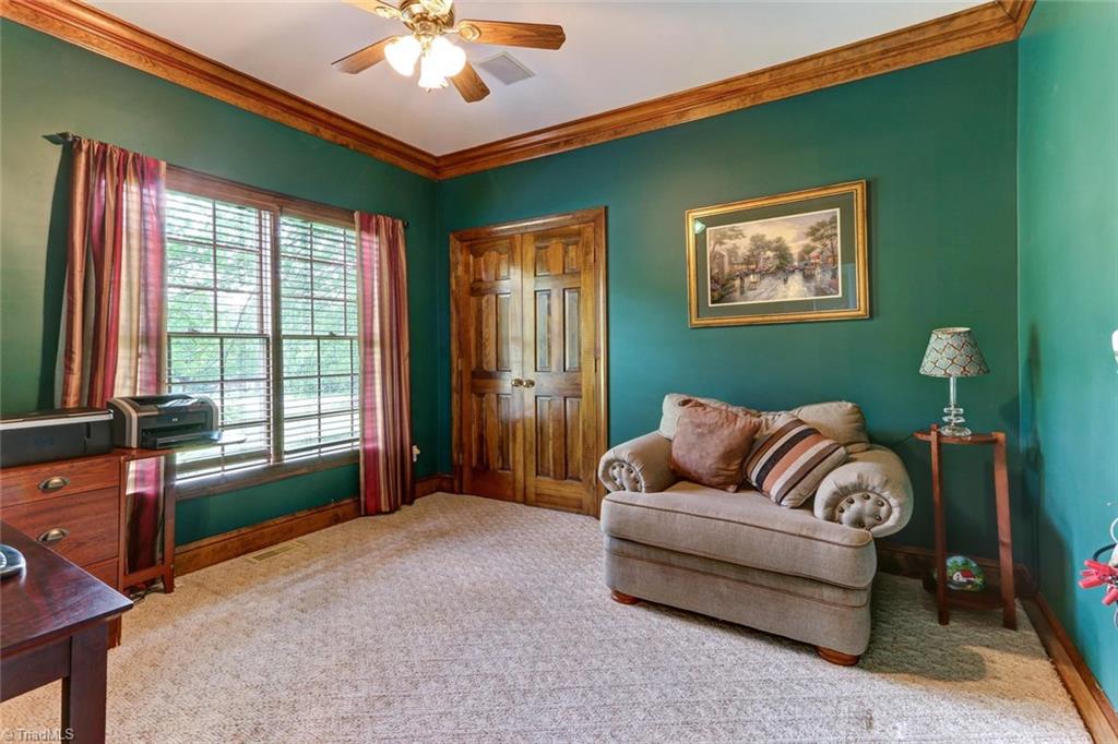 5203 Red Fox Drive Oak Ridge, NC 27310 - Photo 6 of 30 To the left as you enter is an office (or possible living room) wired for all of your home office needs.