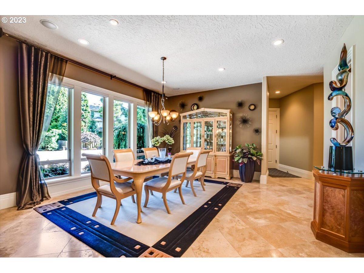 1531 Southeast 26th Drive Gresham, OR 97080 - Photo 13 of 44 a living room with furniture a large window and a chandelier