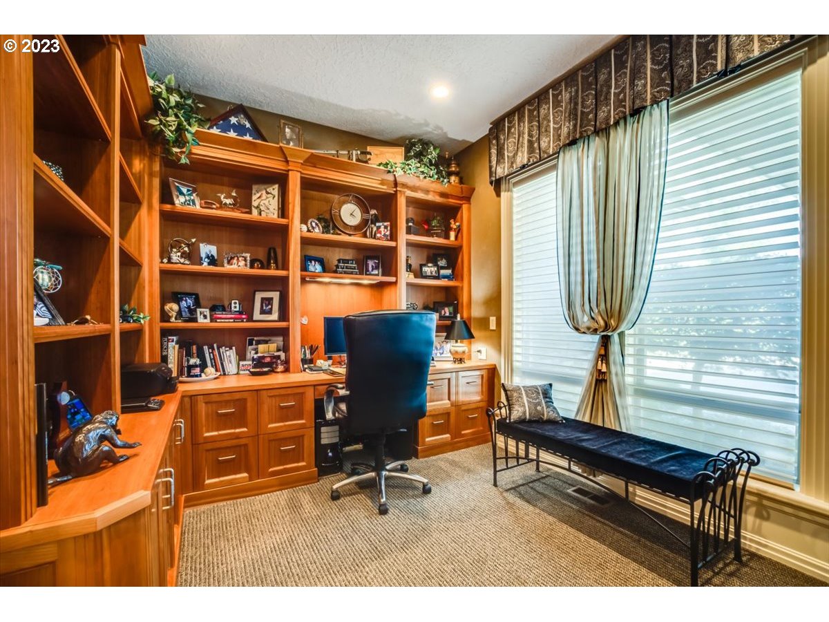 1531 Southeast 26th Drive Gresham, OR 97080 - Photo 16 of 44 a view of a workspace with furniture and a window