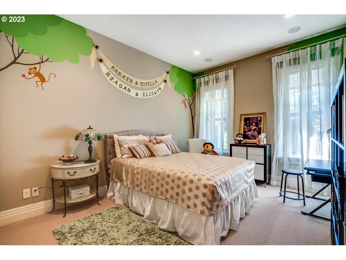 1531 Southeast 26th Drive Gresham, OR 97080 - Photo 26 of 44 a bedroom with a bed table and a window