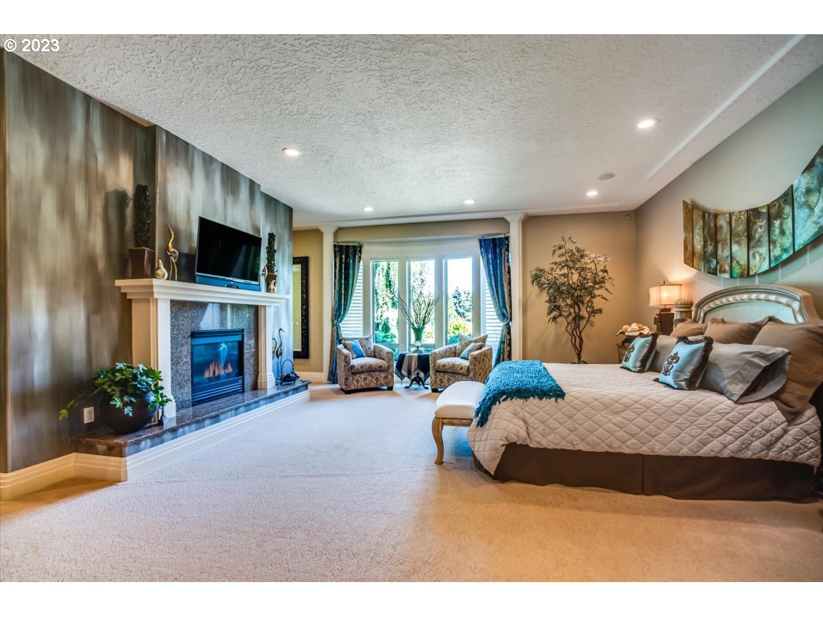 1531 Southeast 26th Drive Gresham, OR 97080 - Photo 29 of 44 a bedroom with furniture and a fireplace