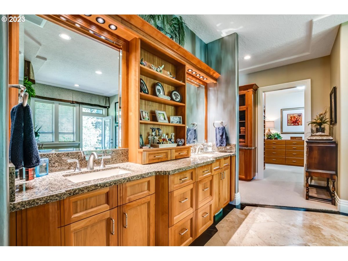 1531 Southeast 26th Drive Gresham, OR 97080 - Photo 32 of 44 a kitchen with stainless steel appliances granite countertop a sink and cabinets