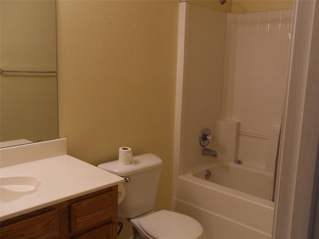 817 Cruise Street Denton, TX 76207 - Photo 6 of 13 a bathroom with a sink and toilet