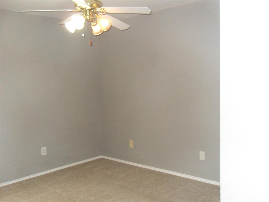 817 Cruise Street Denton, TX 76207 - Photo 8 of 13 a view of a small space with a fan
