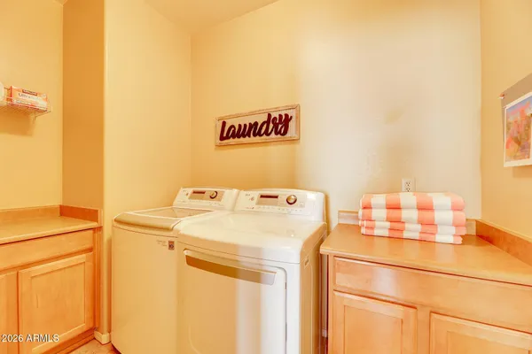 a utility room with dryer and washer