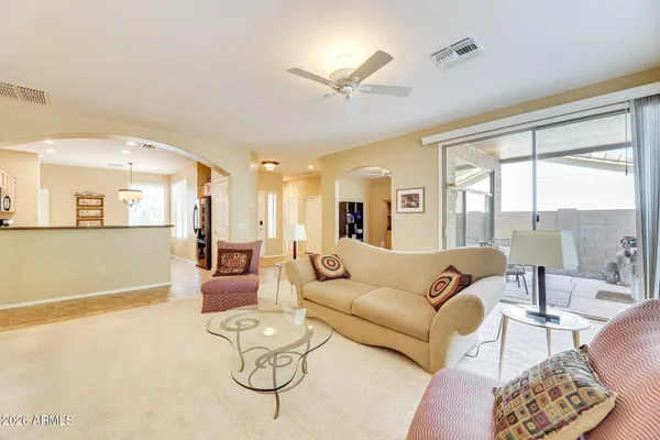 a living room with furniture and a large window