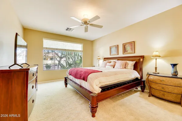 a bedroom with a bed and window