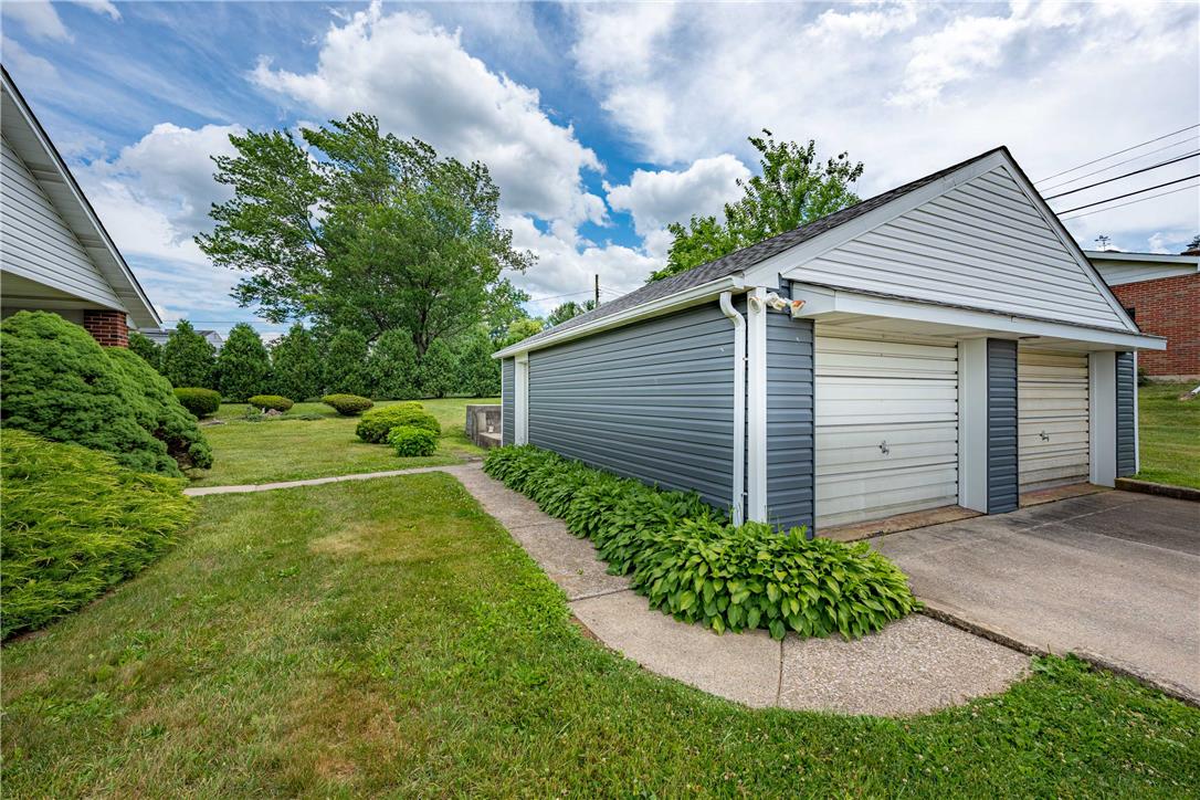 4352 Ruth Road Emmaus, PA 18049 - Photo 28 of 33 Two-car garage with siding, offering ample parking and storage options.
