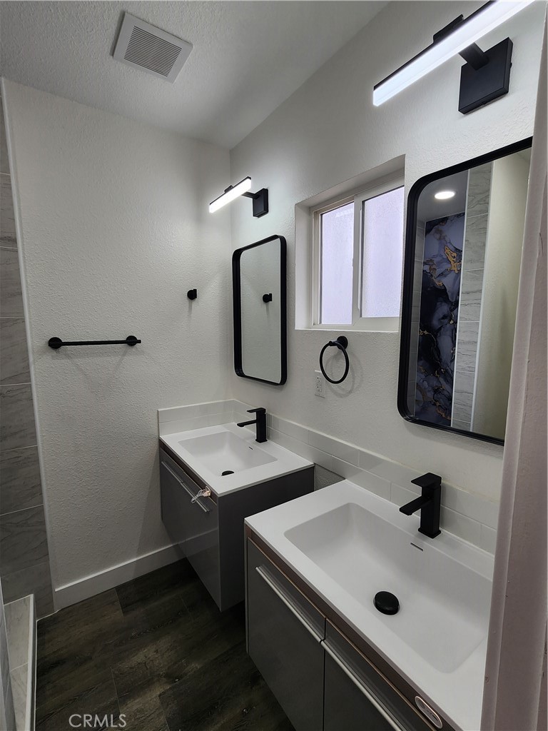880 South State Street Hemet, CA 92543 - Photo 15 of 21 a bathroom with a sink and a mirror
