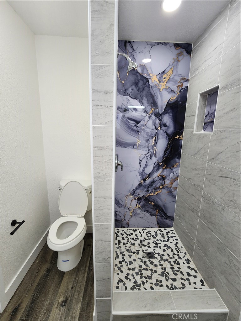 880 South State Street Hemet, CA 92543 - Photo 16 of 21 a bathroom with a toilet and a shower