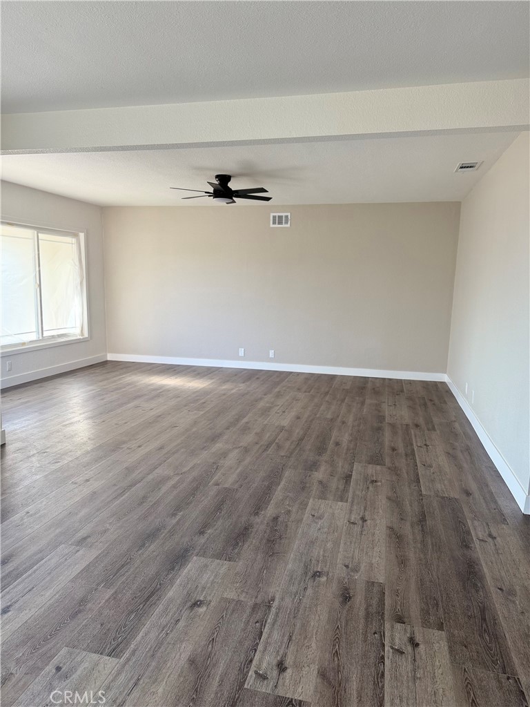 880 South State Street Hemet, CA 92543 - Photo 4 of 21 wooden floor in a empty room