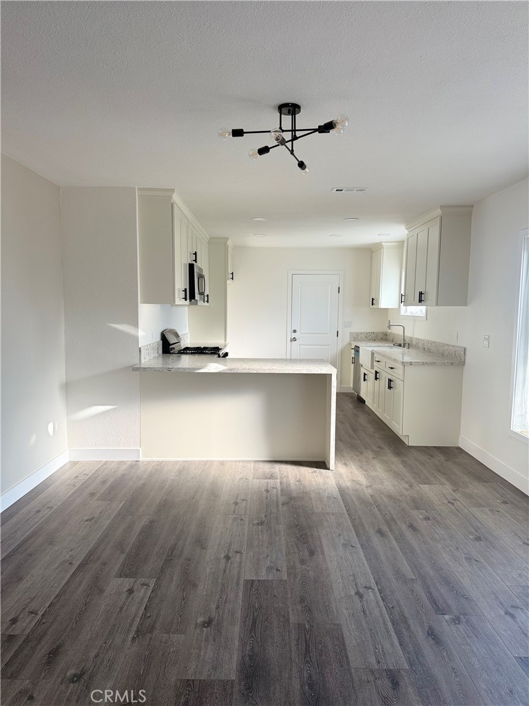 880 South State Street Hemet, CA 92543 - Photo 7 of 21 a view of cabinets and wooden floor