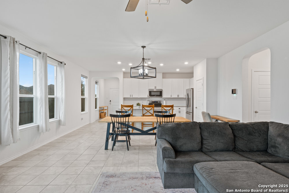 3404 Taurus Sky Converse, TX 78109 - Photo 12 of 27 a living room with furniture a dining table and chairs