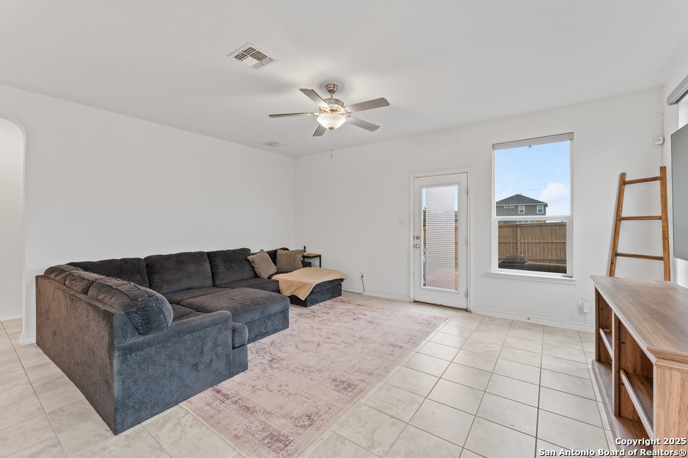 3404 Taurus Sky Converse, TX 78109 - Photo 10 of 27 a living room with furniture and a chandelier