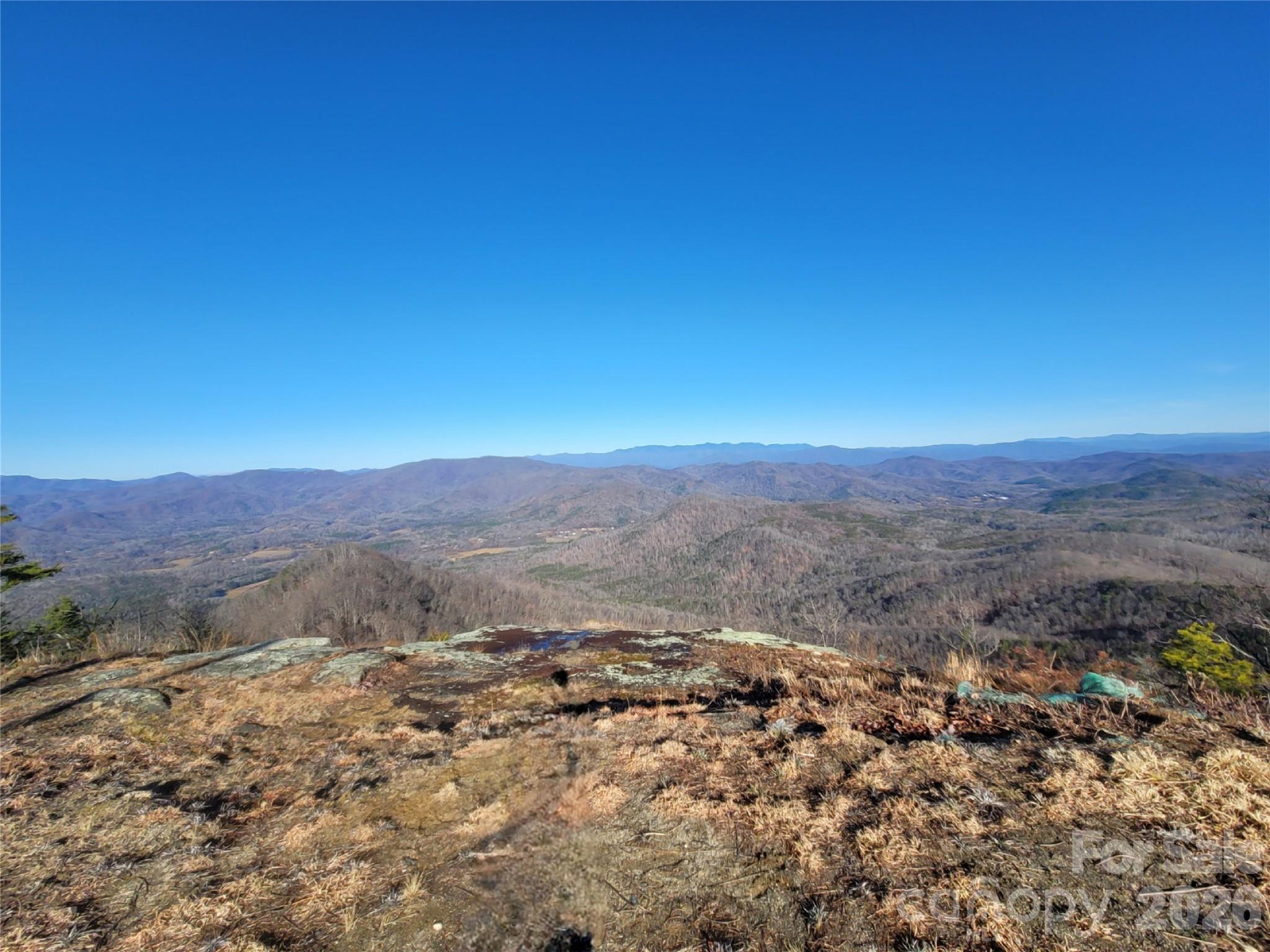 0 Devin Ridge Lane Union Mills, NC 28167 - Photo 11 of 13 a view of a dry yard with mountains in the background