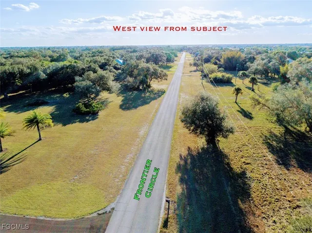 an aerial view of a houses with ocean view