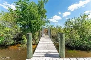 a view of a pathway both side of the house
