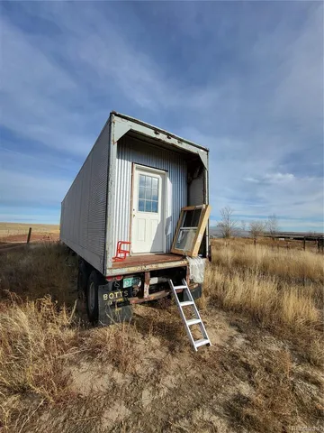 a view of a backyard of the house