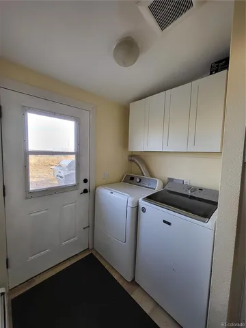 a kitchen with a stove and a refrigerator