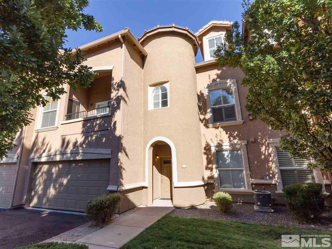 9050 Double R, Unit 1925 Reno, NV 89521 - Photo 1 of 25 a front view of a house with garden