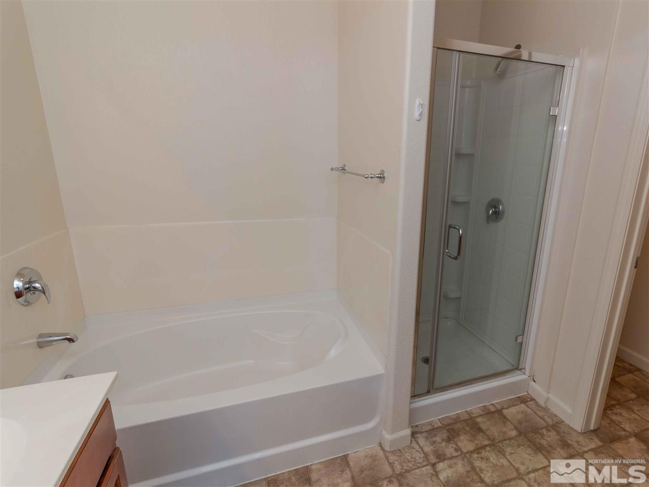 9050 Double R, Unit 1925 Reno, NV 89521 - Photo 11 of 25 a bathroom with a bathtub