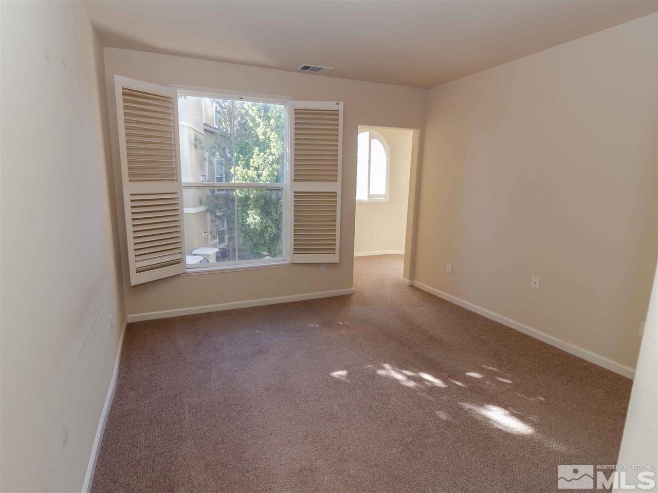 9050 Double R, Unit 1925 Reno, NV 89521 - Photo 14 of 25 a view of an empty room with a window
