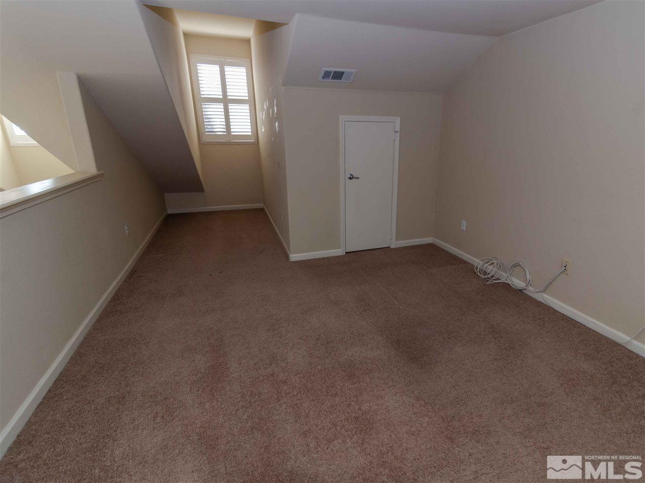 9050 Double R, Unit 1925 Reno, NV 89521 - Photo 17 of 25 an empty room with windows