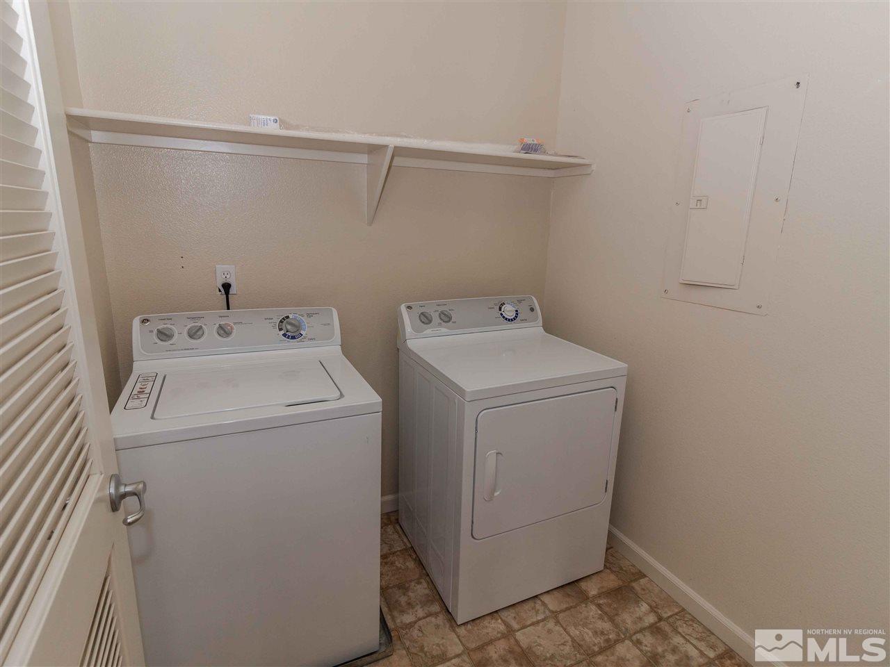 9050 Double R, Unit 1925 Reno, NV 89521 - Photo 19 of 25 a utility room with dryer and washer