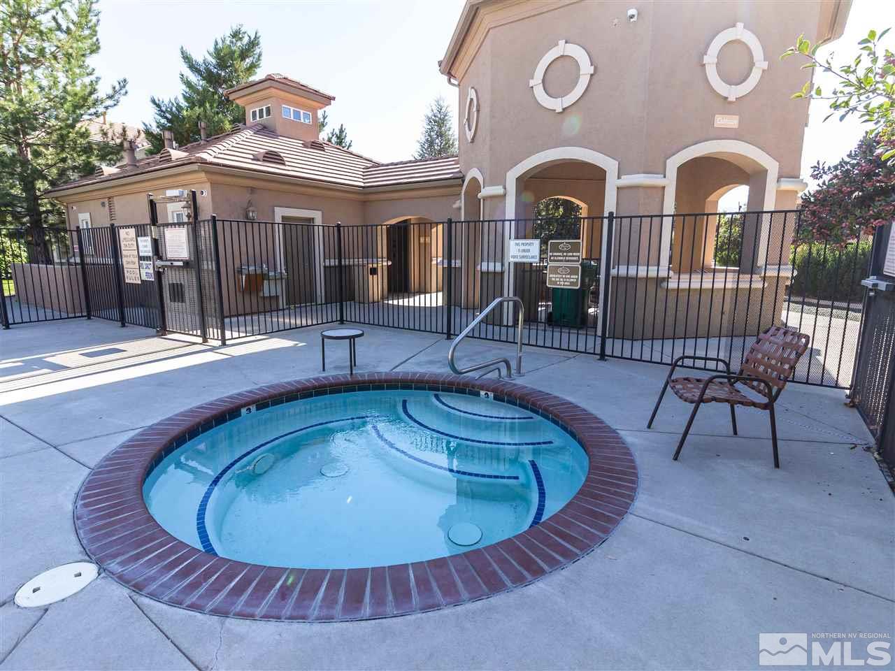 9050 Double R, Unit 1925 Reno, NV 89521 - Photo 22 of 25 a view of a house with a swimming pool and porch