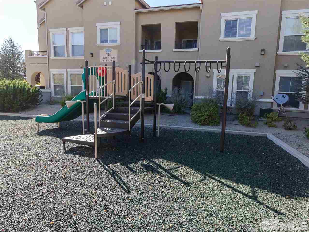 9050 Double R, Unit 1925 Reno, NV 89521 - Photo 23 of 25 a view of a house with backyard and sitting area