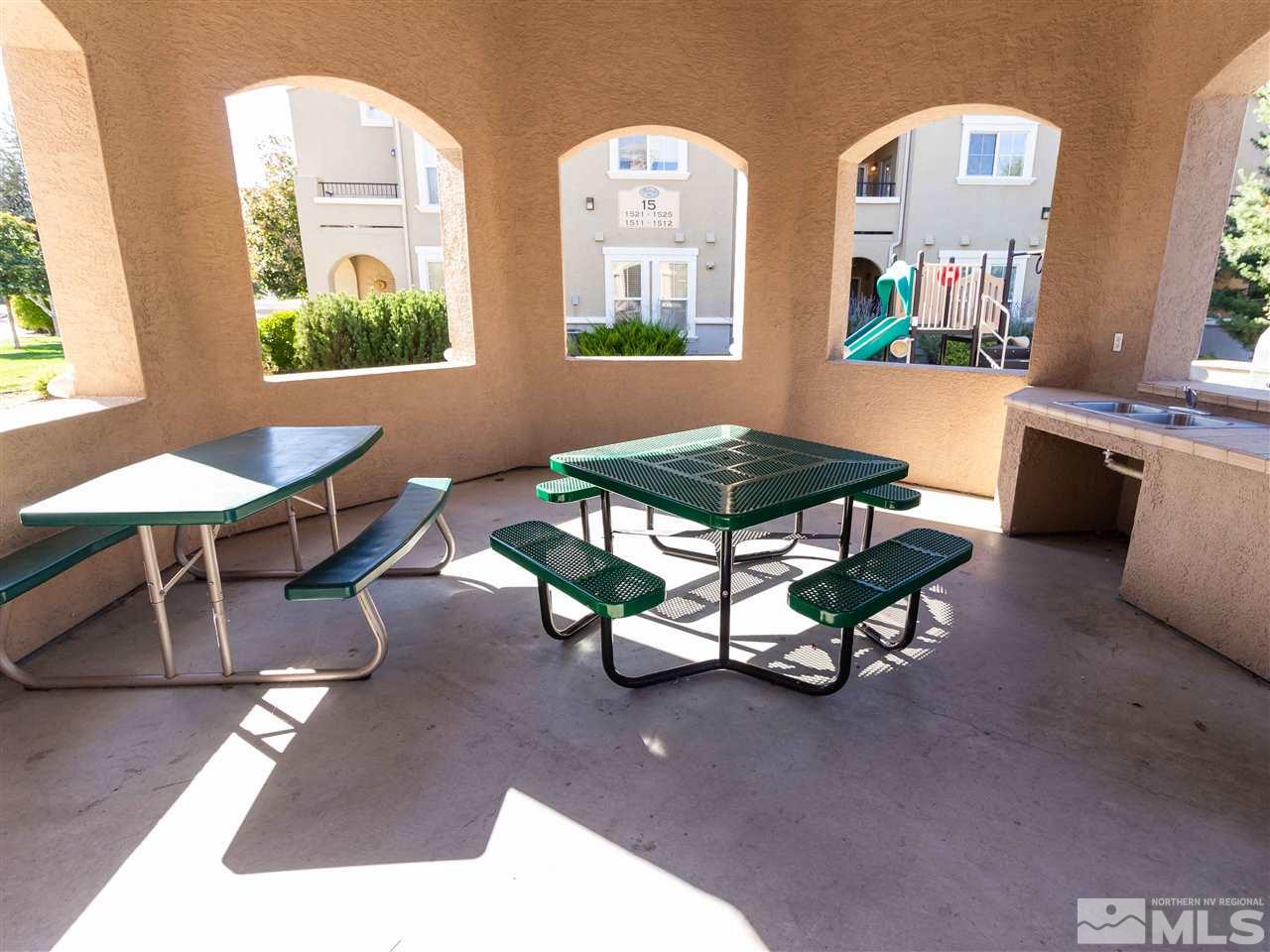 9050 Double R, Unit 1925 Reno, NV 89521 - Photo 24 of 25 a living room with furniture and a table